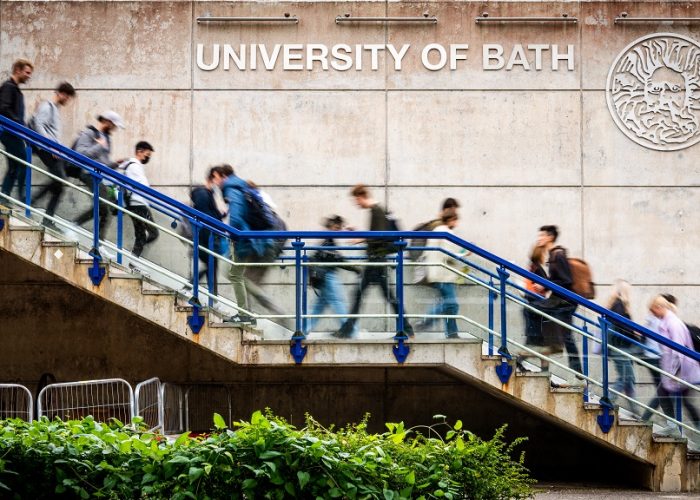 30266 Campus Shots 7 Oct 2021.  Students walking past University Sign and SU Building. Shots with slow shutter causing motion blur Client: Louise Scattergood - CS